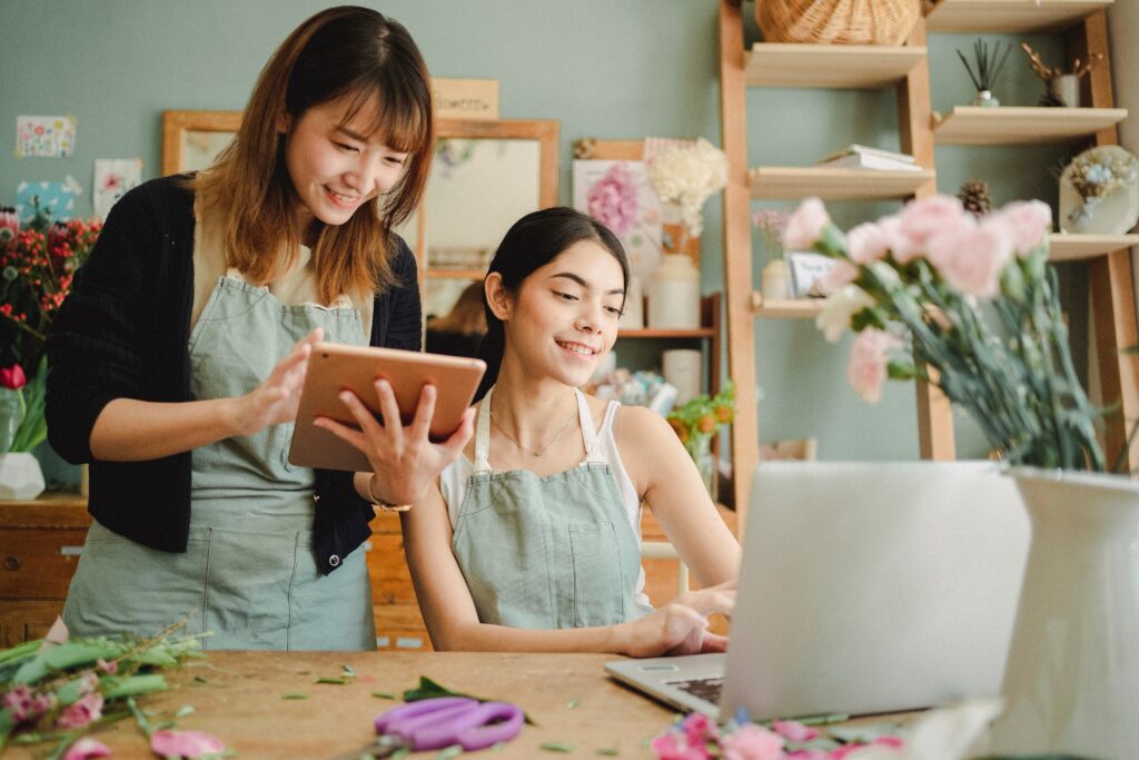 Two women working on their floral business.