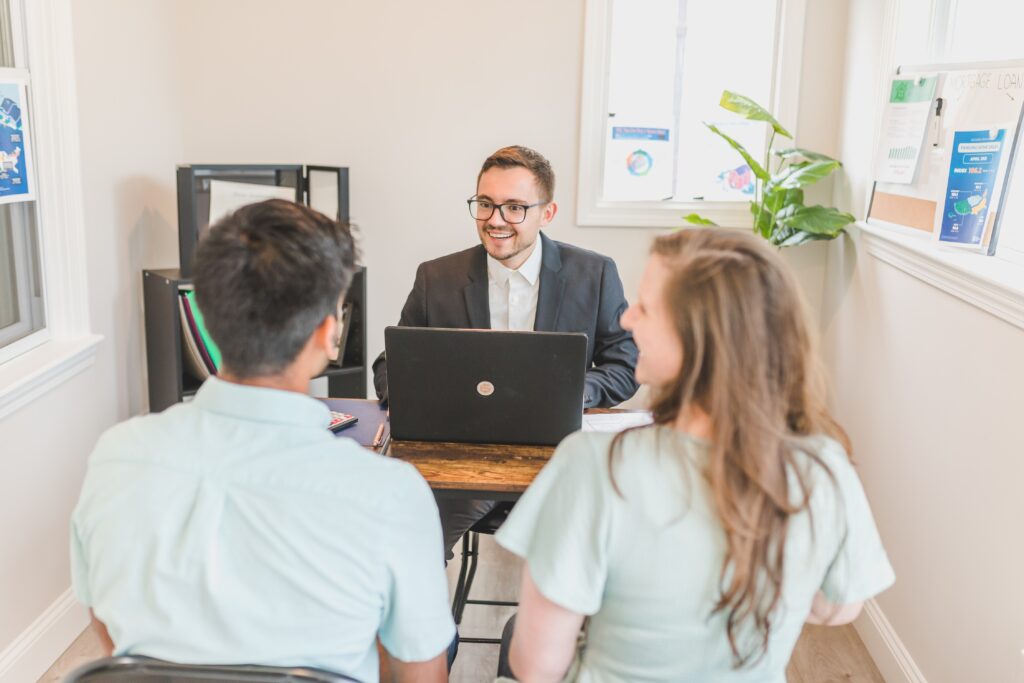 Couple working with a loan officer.