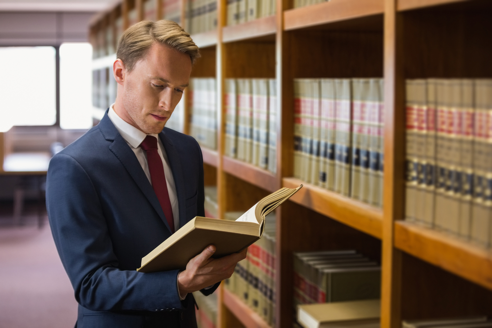 Handsome lawyer in the law library at the university-3